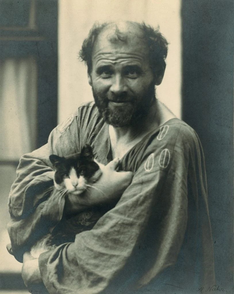 Gustav Klimt with his cat Katze.
